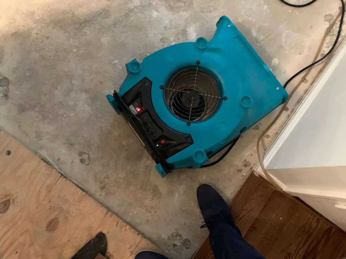 Air mover drying subfloor during Commercial Water Damage Restoration in Poway